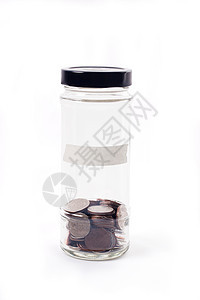 白色背景玻璃罐中的硬币 用于省钱的财务概念帮助订金生长贷款现金货币商业乞丐玻璃金融图片