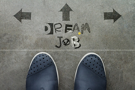 在商务人士们脚前手工绘制了DREAM JOB设计词 a图片