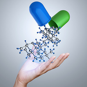 以胶囊药丸和分子为医学概念的手图片