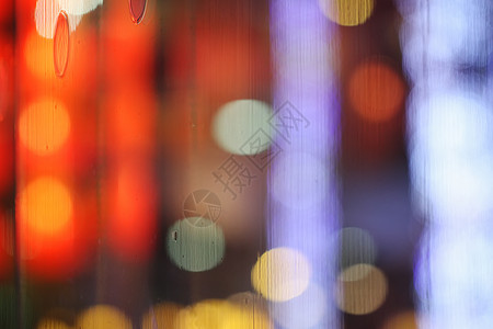玻璃背景上反射的抽象模糊散景辉光假期墙纸庆典圆圈派对图片