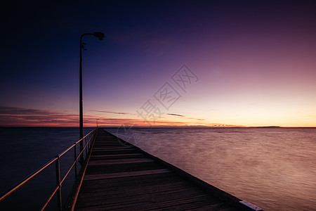 澳大利亚日出时的Rye码头地平线旅游海滩旅行太阳海洋海岸线钓鱼天空海岸图片
