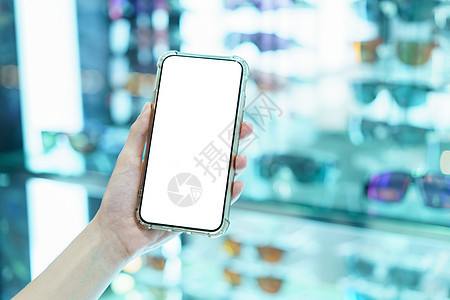 Mockup 握着空白白屏幕移动电话的手模糊电话细胞展示购物中心白色店铺手机商业工具市场图片