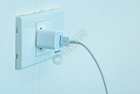 房屋墙上挂着的封闭电源插座背景图片