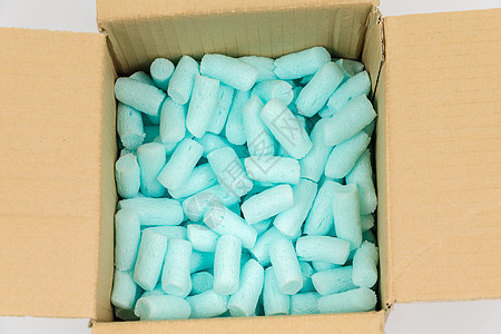 蓝色泡沫塑料颗粒材料船运邮件邮寄纸板白色棕色包装盒子花生图片