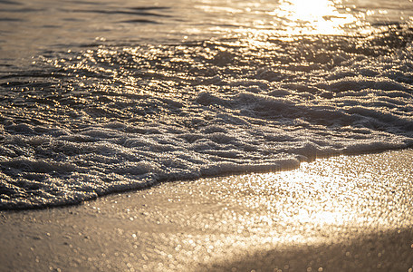 海边海滩 特写日出冲浪蓝色阳光海洋海浪气泡热带力量金子戏剧性图片