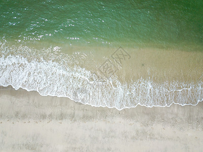 在清洁沙沙滩上的蓝海浪热带自然旅行晴天天堂冲浪海景日落蓝色海岸线图片