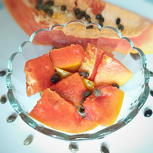 橙色新鲜木瓜保留在白色背景中 碗里有切片 并富含纤维维生素C和抗氧化剂 刺激你的免疫力 对糖尿病人和眼睛有好处盘子热带营养浆果情图片