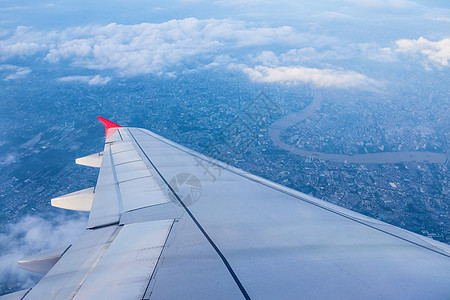 翅膀的图像平面旅行阴影运输土地白色飞机喷射航班蓝色气氛图片