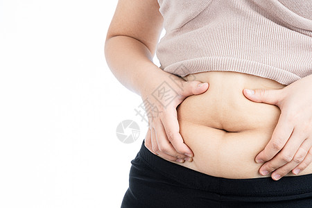 胖女人拿着过多的脂肪腹部 超重的脂肪腹部在白色背景下被隔离 饮食生活方式 减肥 胃肌 健康理念组织压力身体检查肚子损失肥胖腰部数图片