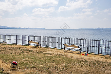 海岸和海景的长坐地平线长椅海洋热带旅行板凳太阳蓝色木头风景图片