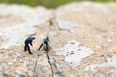 在混凝土上工作的工作团队服务岩石数字工人石头工具玩具职业维修裂缝图片