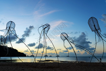 日落天空背景中的水母的图案艺术支撑蚊子钓鱼海洋海景日出热带海岸线地平线图片
