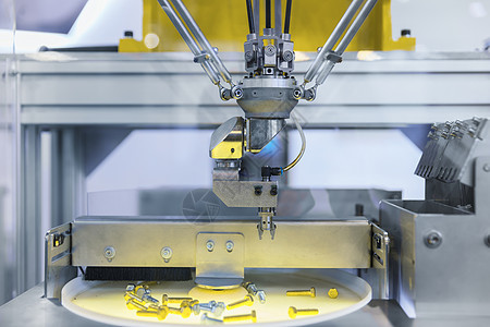 自动机器人臂在工业环境中工作 分出螺丝式螺丝坚果工程师生产机器人技术硬件机器工具机械臂拧紧图片