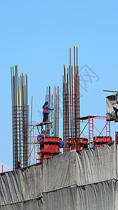 高楼建筑工地的工人进步财产风险水泥项目蓝色格子城市生活办公室图片