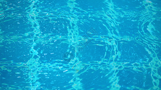 水池的雨滴环境波纹液体蓝色圆圈季节海浪下雨太阳海洋图片