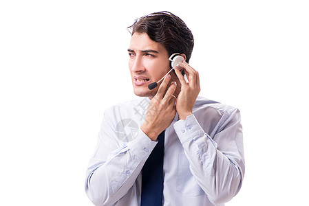 在白色背景上与耳机隔离的男子热线服务台工作顾客推销操作员中心桌子男性代理人图片