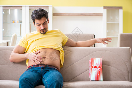 饮食概念中的年轻胖子腰部食物测量营养代谢损失示范腹部大腹肥胖图片