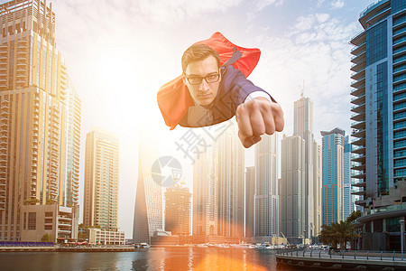 超级英雄商务人士飞过城市上空大男子自由帮助领导者套装队长飞行英雄力量乐趣图片