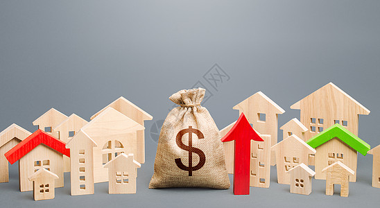 美元钱袋子和房子数字和红色向上箭头的城市 楼价复苏增长 需求旺盛 租金上涨 增加市政预算收入 投资图片