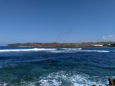 蓝色海滩的美丽风景 海滩 印度尼西亚东爪哇 Blitar 美丽的印度尼西亚海滩之一地平线旅行椰子日落假期运输海景海岸天空热带图片