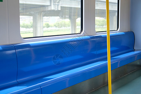 电动列车的座椅坐运输交通车辆民众火车座位黄色过境乘客旅行图片