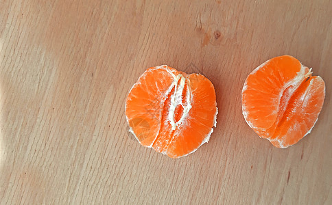 木制背景的电动膜 复制空间照片热带甜点活力木头圆圈橙子叶子宏观水果饮食图片