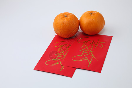 中国新年橙子红色庆典传统祝福风俗白色展示信封礼物图片