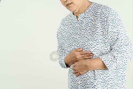 受酸液回流或心脏灼伤的高级女性家具公寓痛苦冒号胃炎病人腹泻医生疼痛腹部图片