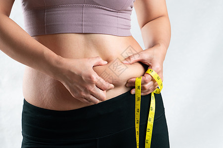 胖女人 胖肚子 胖乎乎的 肥胖女人手握过度饮食损失组织食物卷尺紧缩女性重量糖类碳水图片