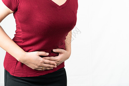 患有腹部疼痛的年轻女子肚子痛 胃痛疾病病人家具医生药品诊所女性伤害胀气胃炎图片