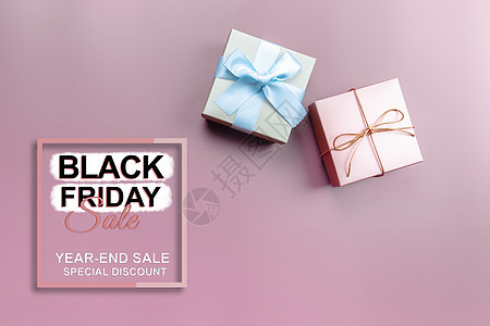 黑色星期五销售 特别日粉红背景的礼物盒标签价格商业海报节日折扣晋升购物季节手机图片