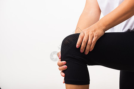 女人的膝盖疼痛 用手握膝关节女士身体按摩治疗风湿事故卫生风湿病药品伤害图片