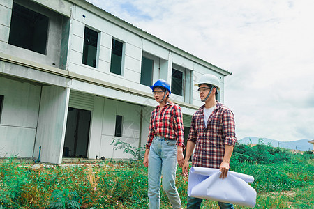 年轻的亚裔夫妇工头工程家主房检查大楼建筑学工程师机械服务技术员男性头盔项目承包商工人图片