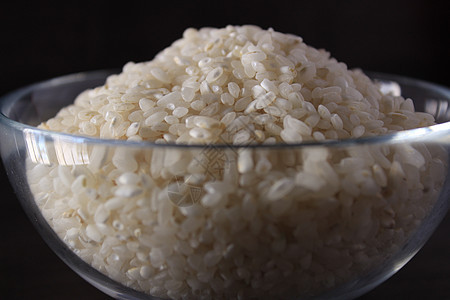 白稻纹理和玻璃碗背景美食营养稻田糖类主食种子健康谷物餐具农业图片