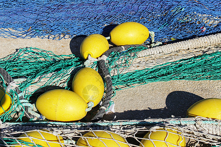 西班牙阿利坎特圣波拉港的渔网港口工作绳索漂浮编织渔夫细绳网络材料尼龙图片