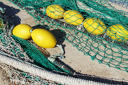 西班牙阿利坎特圣波拉港的渔网工作港口打猎细绳渔夫海鲜蓝色网络工具乡村图片
