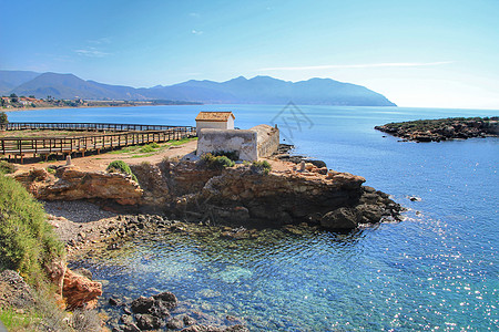 卡塔赫纳海岸Isla Plana海滩旧热浴池浴室海浪海岸线悬崖海岸蓝色海洋支撑观光假期图片