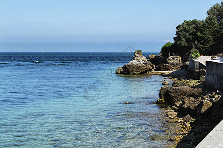 里斯本Portinho海滩水晶水旅游晴天蓝色气氛曲线摄影水湾悬崖海浪海岸线图片