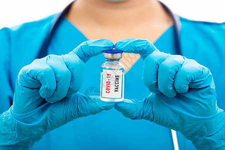 持有COVID19疫苗的蓝制服女医生诊所液体治疗橡皮护士面具疾病注射玻璃实验室图片