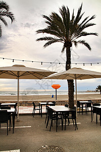 圣波拉海滩有露台的餐厅海滩家具酒吧咖啡店椅子海洋支撑地面阳台天空图片