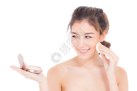 美丽的亚洲女人的肖像 用粉泡在脸颊上女士女孩成人皮肤化妆品魅力粉末治疗肤色腮红图片