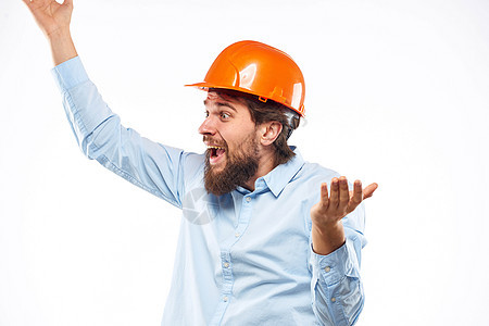 男子在工作制服 橙色头盔职业安全行业的建筑中男人男性衬衫工程师黄色成人商业承包商工程工人图片