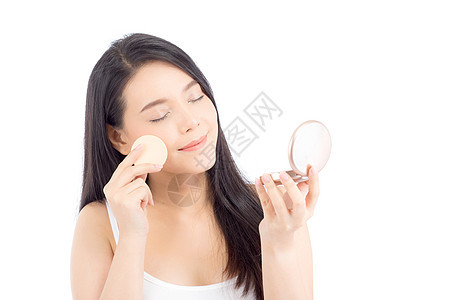 美丽的亚洲女人的肖像 用粉泡在脸颊上成人美容女士粉末化妆品腮红护理魅力女孩皮肤图片