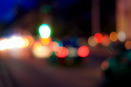 夜间汽车灯和灯灯灯的模糊灯光c城市街道头灯路灯圆圈耀斑灯笼场景运动运输图片