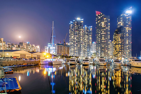 港口码头夜景釜山海洋城的夜景和反光画面商业假期云台建筑学市中心场景海岸城市支撑港口背景