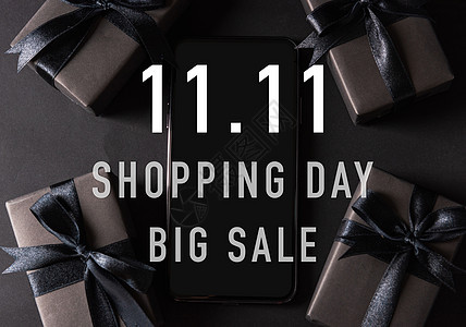 包着黑纸和黑色弓领带的礼盒互联网折扣购物礼物展示销售电话丝带假期屏幕图片