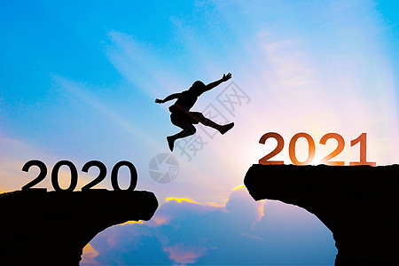 2020年至2021年新年概念之间的人跳轮人士生长天空假期挑战商务场地男性快乐商业背景图片