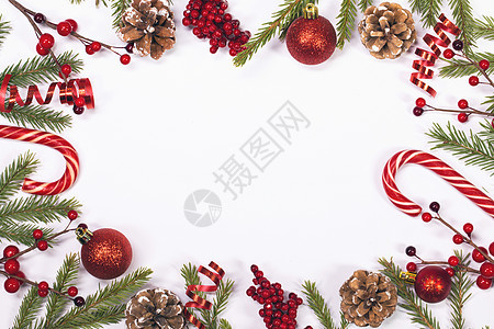 圣诞背景 附有装饰品季节丝带甘蔗糖果假期锥体风格装饰浆果花圈图片