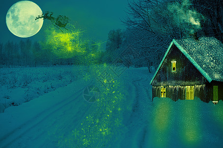 圣诞老人和鹿在雪橇上飞 房子是雪地的圣诞景色图片