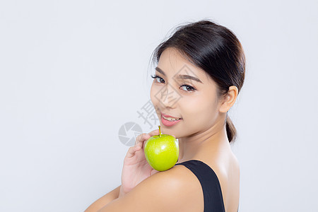 肖像的亚洲女人微笑着 拿着绿色苹果水果和美容营养饮食腰部组织女士内衣皮肤腹部女性女孩图片